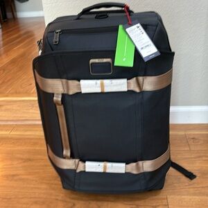 tumi alpha bravo wheeled backpack - International 2-Wheeled Duffel Carry-On - Adjustable Compact Travel Bag - 21.75" X 14.0" X 9.0" - Black two zippered pockets Tumi Alpha Bravo Tumi Luggage